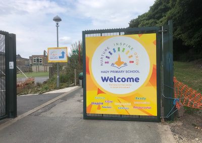 Welcome gate school signage